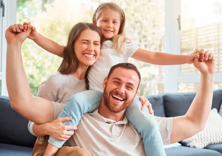 Happy family smiling at Henderson & Goslee Family Dentistry